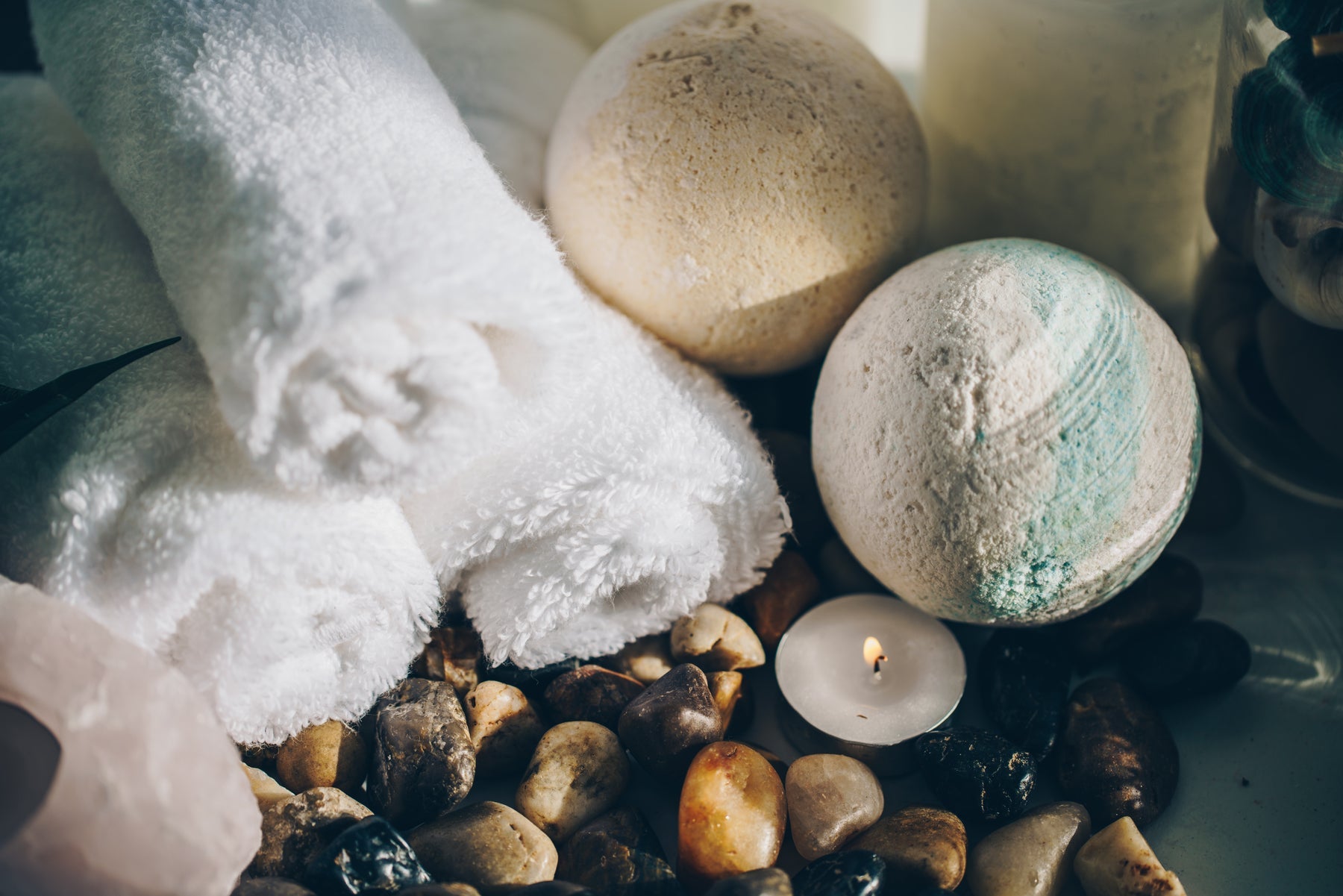 Spa candle towel and stones